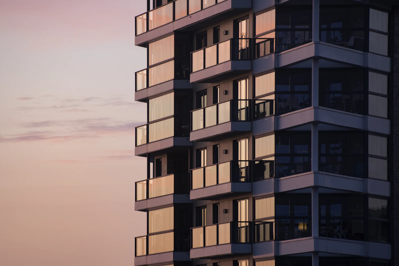 Class A multifamily apartment building with glass balconies